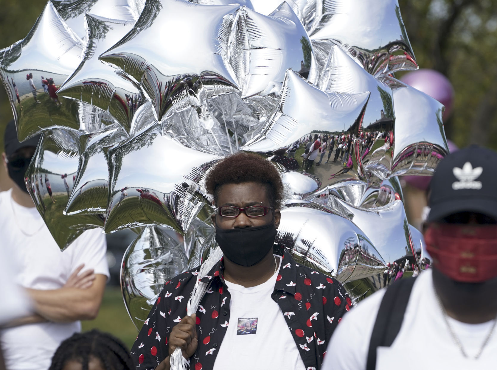Mourners gather in park